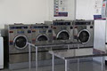 Spincity Serviced Coin Laundry logo