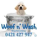 Woof N' Wash Dog Grooming logo
