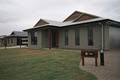 Manadam Homes logo