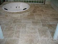 NATURAL STONE BATHROOMS logo